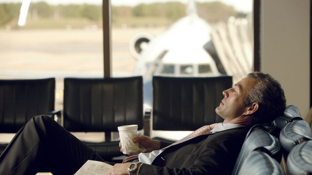 traveler sleeping in terminal
