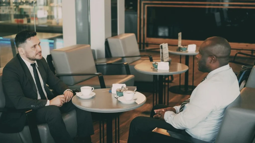 las vegas airport lounge for rest: two men having coffee at airport lounge