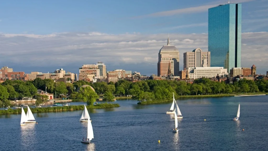 boston skyline with sailboats on the water