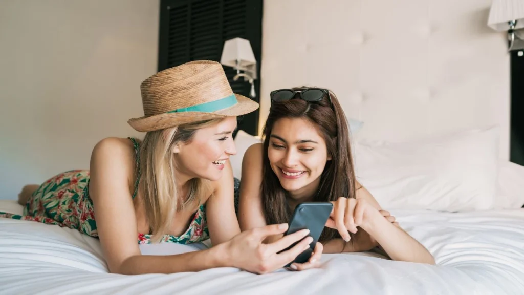 two ladies relaxing in hotel room