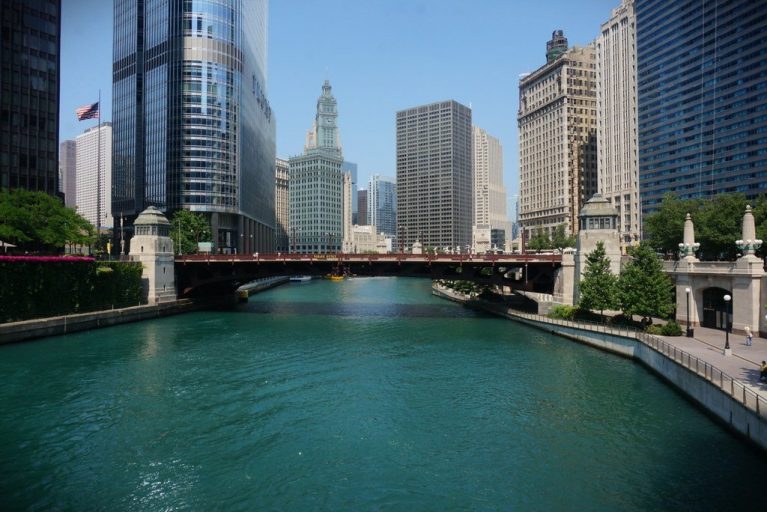 View of the Chicago River, Canal Street bridge, lined with beautiful buildings.
