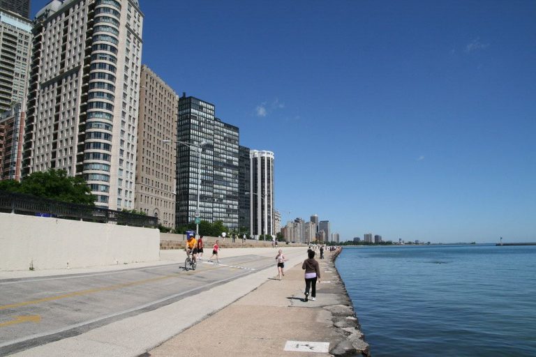 Walkers, joggers and bicyclists line the Chicago lakefront path.