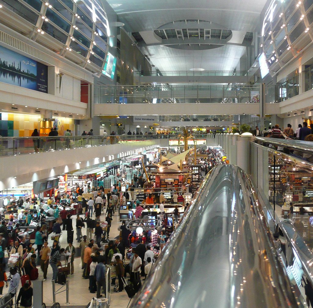 Crowded airport concourse in Dubai, United Arab Emirates (UAE), in the early morning hours.